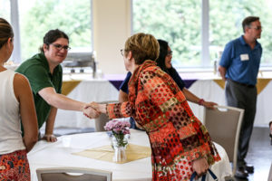 sterritt handshakes student