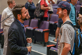 vassel speaks with student