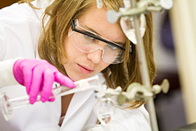 Scientist with beaker