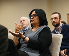 Woman responds during lecture