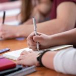 students taking notes in class at Saint Michael's College
