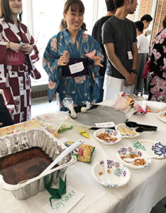 students from Japan serve coffee