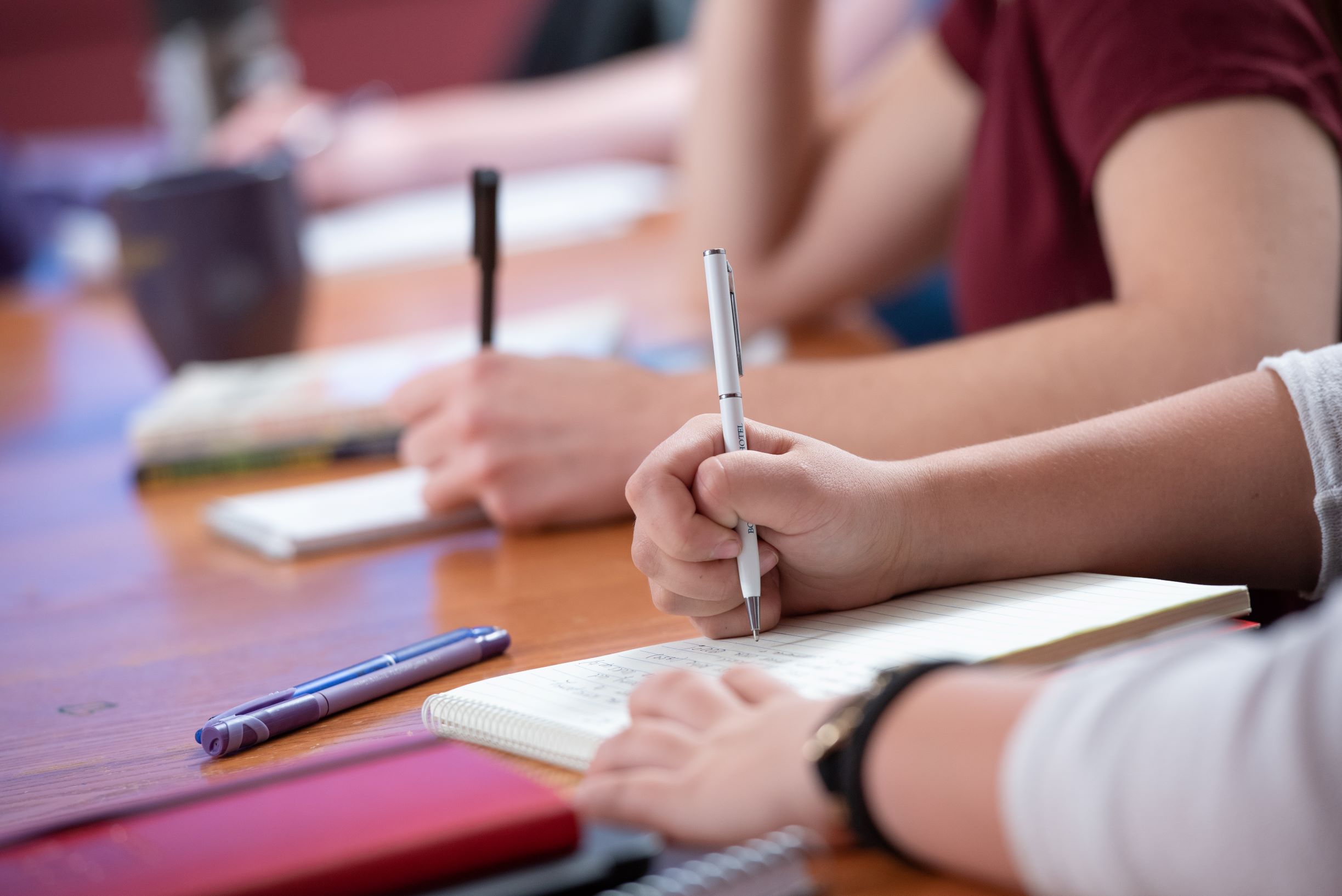 Students writing notes