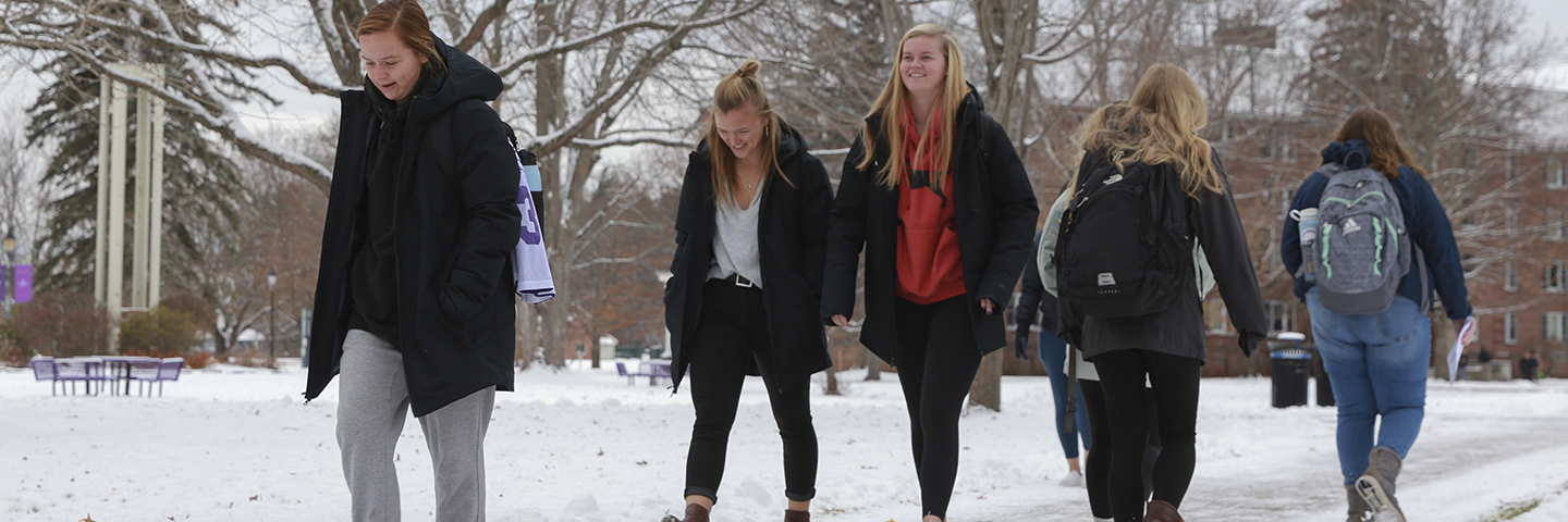Students walk to class on a winter day at Saint Michael's College in Colchester, Vermont.