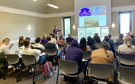 To a full house, lecturer Ryan Shea suggests how poetry can help us read the book of nature