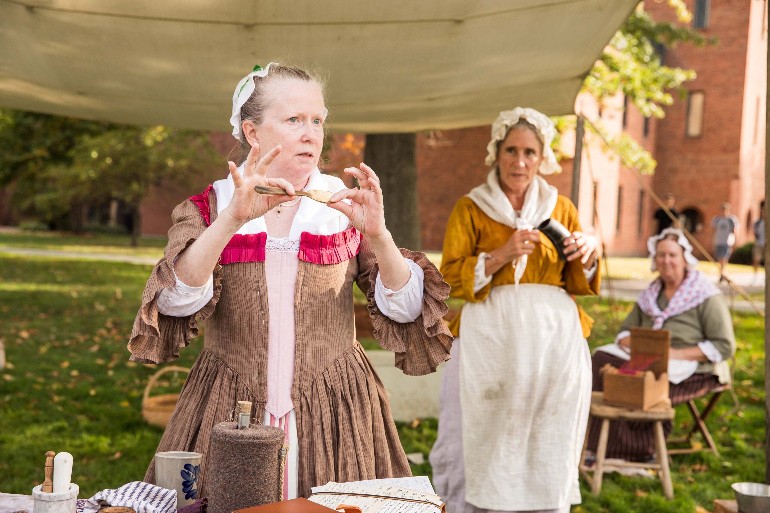 historical reenactors do presentation on the campus green.