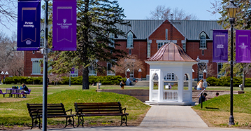 picture of the center of campus with the cupola and purple banners