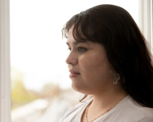 Isabella Paredes Mendoza '24 in profile in front of a window