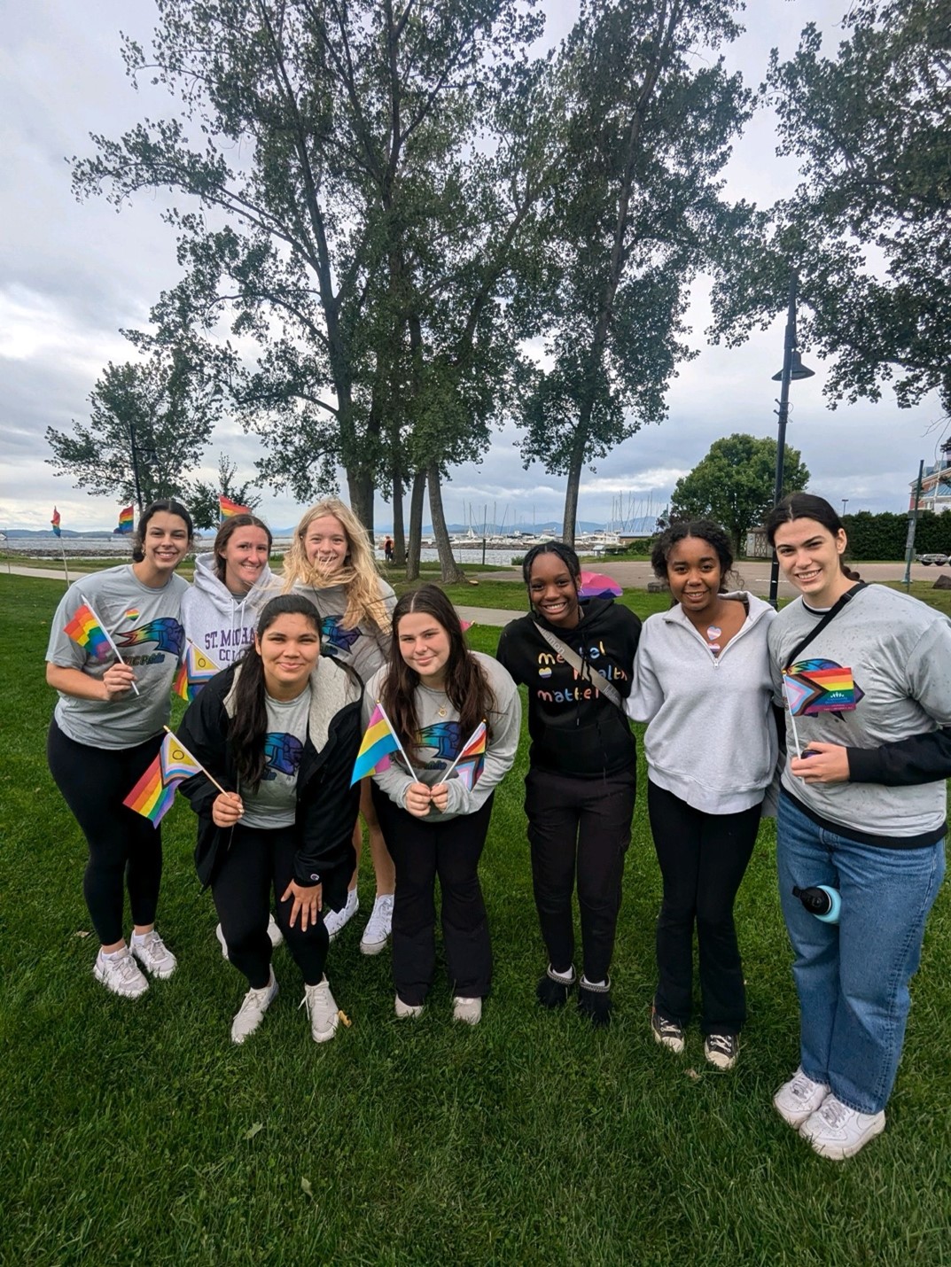The Saint Michael's women's volleyball poses at the Burlington Pride event in 2024.