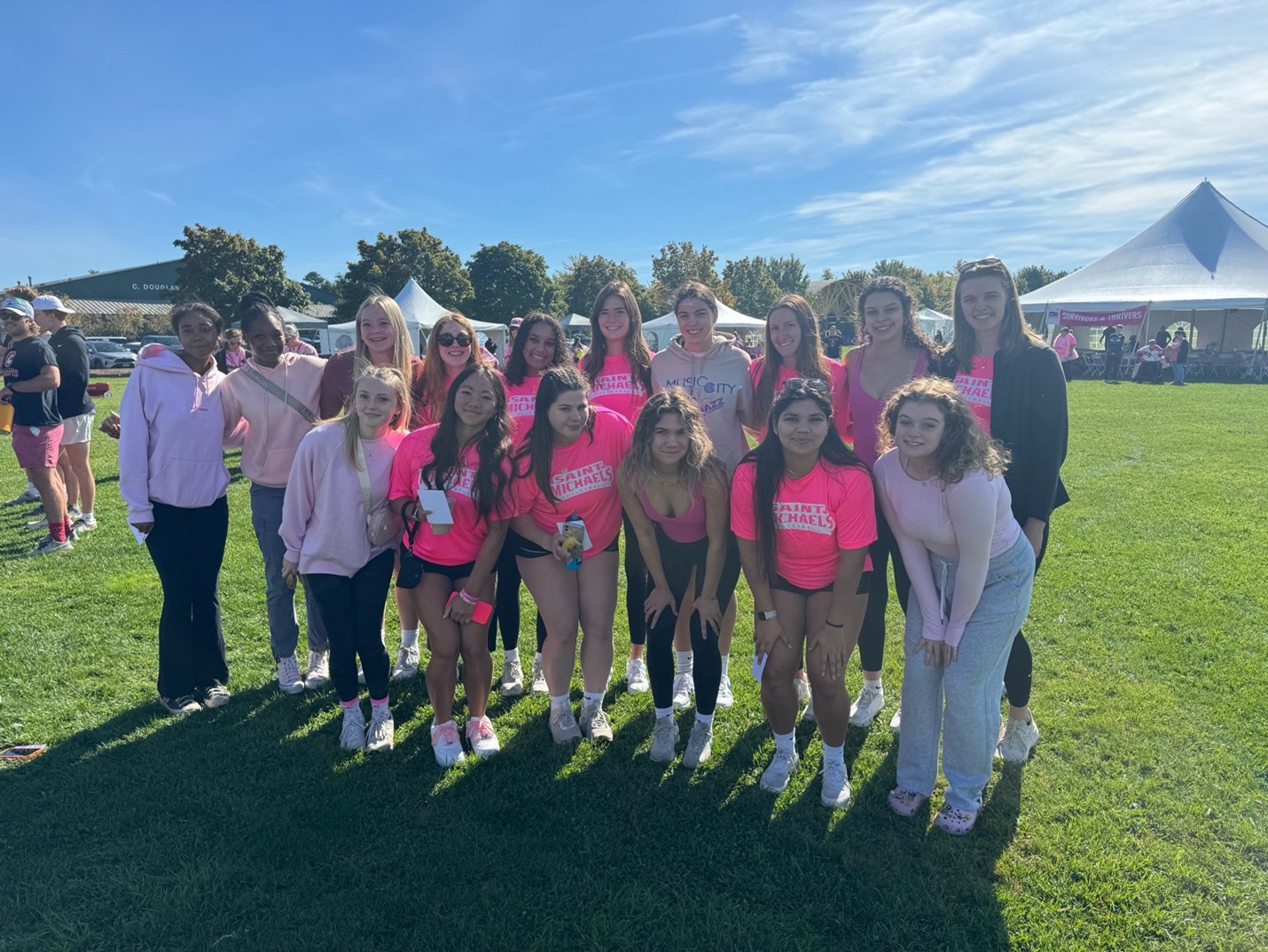 The Saint Michael's College women's volleyball team poses together at an event in South Burlington.