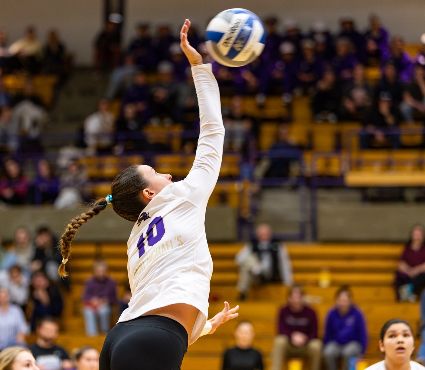 Dana Welch goes up for a hit in a Saint Michael's women's volleyball match in the Ross Sports Center.