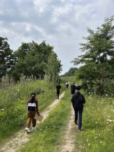 USCRIS Scavanger Hunt particpants on a trail in the Saint Michael's College Natural Area