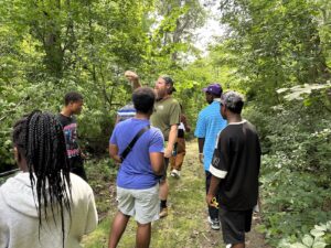 USCRIS Scavanger Hunt particpants on a trail in the Saint Michael's College Natural Area