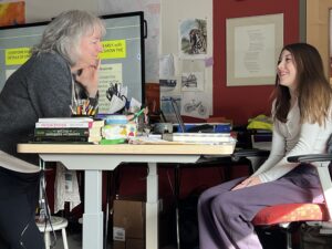 Shelburne Community School Humanities teacher Meg O’Donnell '88has a discussion with a student about what they learned in a world religions unit. Photo by April Barton.