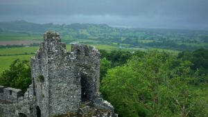 A castle in Dinefwr Park overlooking the sprawling Welsh countryside