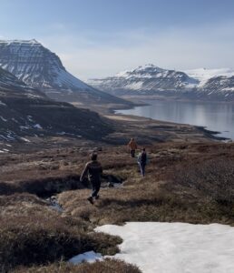 Students walking along the fjords of Iceland