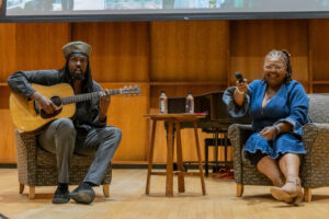 Reggae artist MediSun performs during an Institute for Equity and Justice event with Director Jolivette Anderson-Douoning.