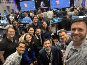 Jared Peick and NASA teammates celebrate splashdown of Artemis II in NASA Mission Control. 