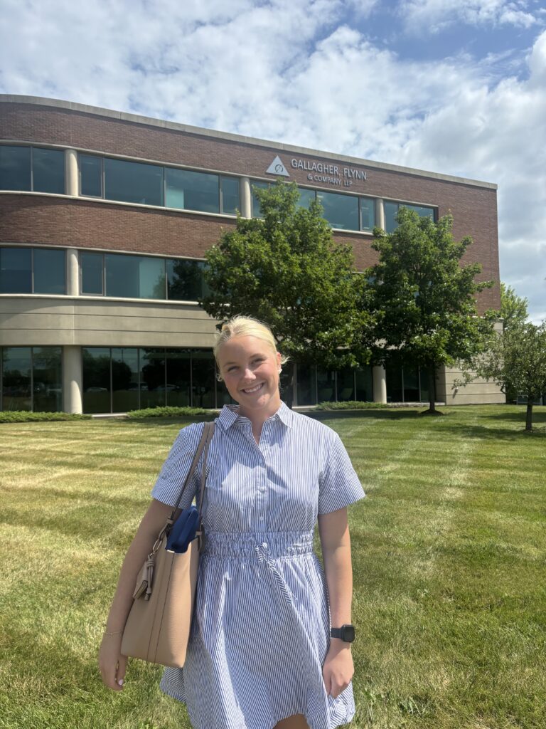 Saint Michael's College Business Administration and Accounting major Emma Gredenhag '27 poses outside of Gallagher, Flynn & Company, where she completed a hybrid co-op during summer 2026. (Photo courtesy of Emma Gredenhag)